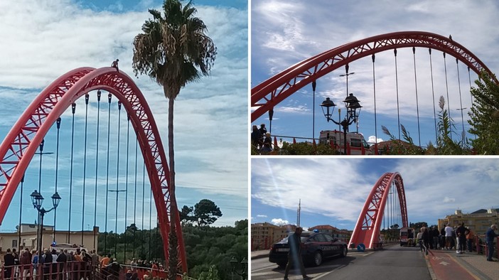 Albenga, giovane si arrampica sul ponte rosso per protesta: soccorsi mobilitati (FOTO e VIDEO)